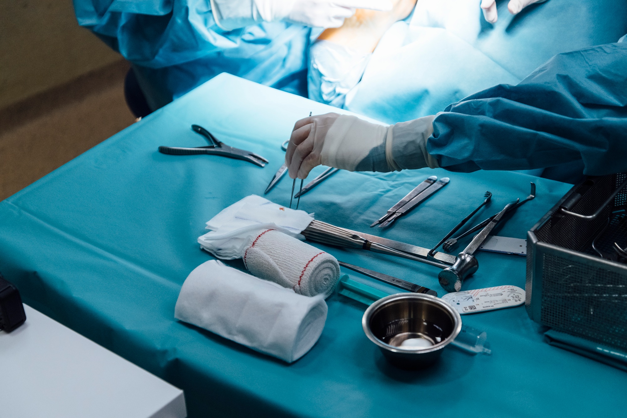 Anonymous nurse preparing equipment for the surgery