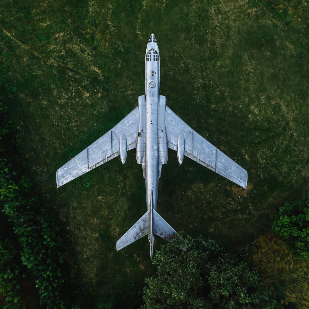 Old plane in the forest. Aerial top down view