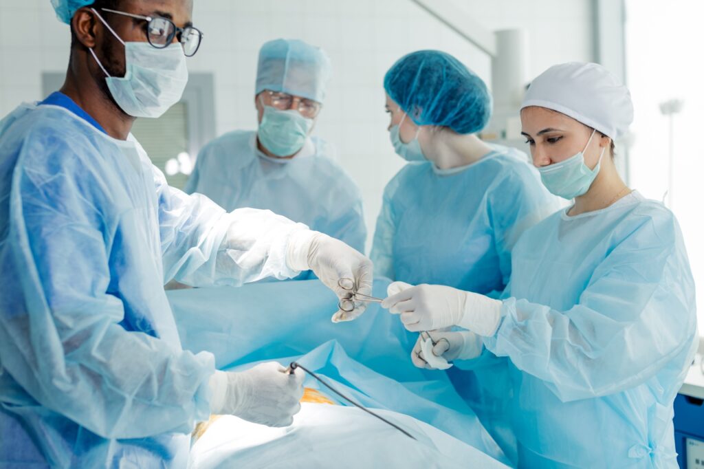 reconstructive surgery. cosmetic surgery group performing procedure