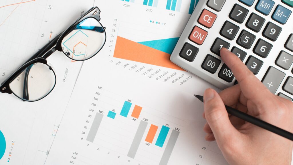 Financial work, accountant, calculation of economic indicators. Top view hand using