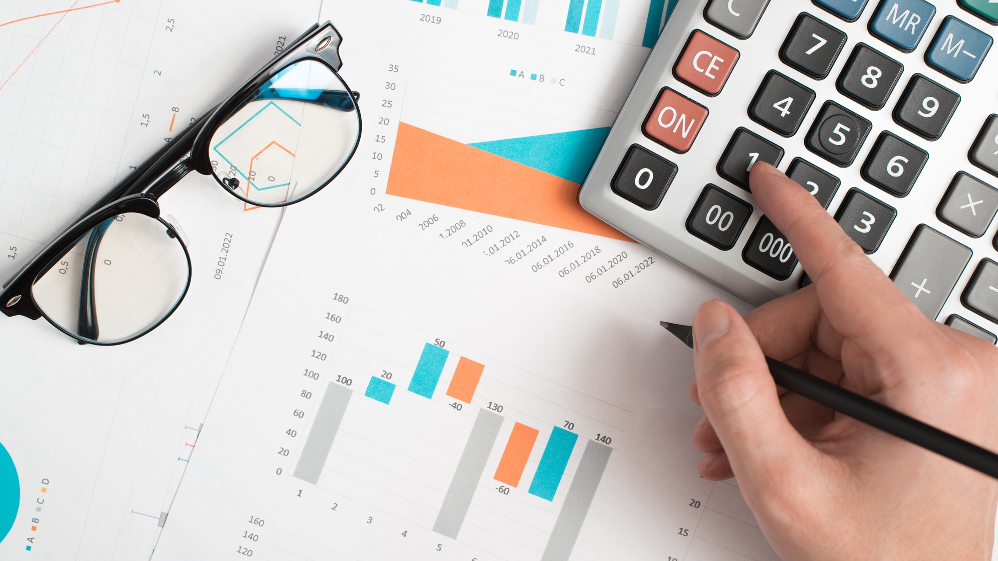 Financial work, accountant, calculation of economic indicators. Top view hand using